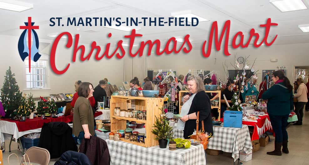 Indoor scene of St. Martin's in-the-Field Episcopal Church hosting a Christmas market with vendors and holiday decorations.